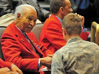 Matt Hinshaw/The Daily Courier<br>
Tuskegee Airman Lt. Colonel Robert Ashby signs an autograph for Embry-Riddle ROTC Cadet Oleksandr Slidenko before the start of a question and answer session Wednesday night at Embry-Riddle Aeronautical University in Prescott.