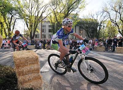 Courier file<br>
A racer rounds a corner near the Yavapai County Courthouse during the 2012 Whiskey Off-Road in Prescott. County supervisors may decide today whether to allow expanded use of the courthouse plaza during this year’s event.