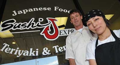 Les Stukenberg/The Daily Courier<br>
Justin Johnson and his wife, Noriko at their Sushi J Express restaurant in the Safeway shopping center at 7840 E. Highway 69 in Prescott Valley.
