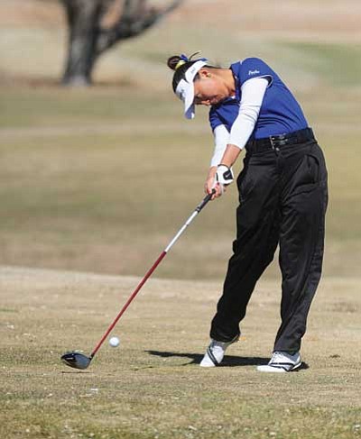 Les Stukenberg/The Daily Courier<br>
Embry-RIddle Aeronautical University golfer Kelly Feng plays in the ERAU Spring Invitational Monday at the Antelope Hills South Course in Prescott.