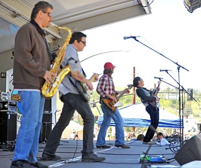 Matt Hinshaw/The Daily Courier<br>Members of Sweet Nasty perform Saturday morning during the 8th Annual Whiskey Off-Road mountain bike racing event in downtown Prescott.
