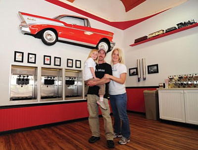 Les Stukenberg/The Daily Courier<br>
Matthew and Denise Crotty, with their daughter Thea, reopened a former yogurt shop and have renamed it Frozen Frannie’s, at 104 West Gurley Street in Prescott.