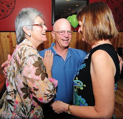 Les Stukenberg/The Daily Courier<br>Debbie Williams and Patty Lasker congratulate Marty Grossman after Grossman won the Prescott Valley Town Council seat.