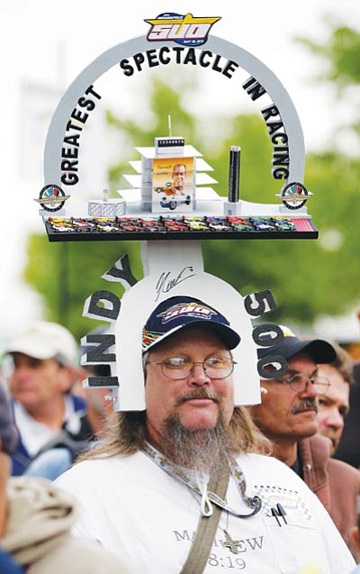 Darron Cummings/The Associated Press<br>
A fan waits in line for autographs at the Indy 500. This could be Casey in a few years if he’s not careful.

