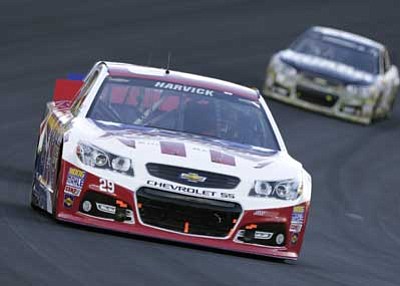 Chuck Burton/The Associated Press<br>
Kevin Harvick races out of Turn 4 during the NASCAR Sprint Cup series Coca-Cola 600 auto race at Charlotte Motor Speedway in Concord, N.C., Sunday.