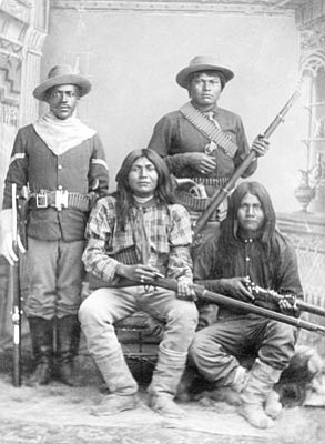 Sharlot Hall Museum/Courtesy photo<br>A Tenth U.S. Cavalry trooper poses with three Apache Indian scouts.
