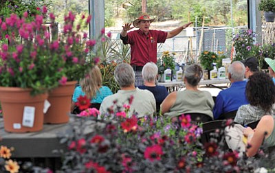 Matt Hinshaw/The Daily Courier<br>
Ken Lain, owner of Watters Garden Center, talks about and displays plants that do well in the high desert enviorment. Attendees of his Saturday gardening class for newcomers learned a lot about gardening in the high desert.