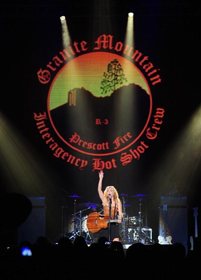 Les Stukenberg/The Daily Courier<br>
Kimberly Perry of The Band Perry performs at the “Country Cares” concert to benefit the Granite Mountain Hotshots at Tim’s Toyota Center, a United Phoenix Fire Fighters Association benefit for the Granite Mountain Hotshots. The concert was arranged by headliner Dierks Bentley, below.