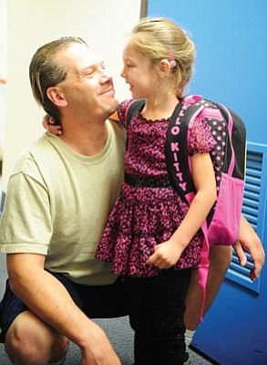 Les Stukenberg, file/The Daily Courier<br>Kyal Marshall shares a moment with his daughter, Kyra, an incoming kindergarten student at Washington Traditional School in the 2012-13 school year.