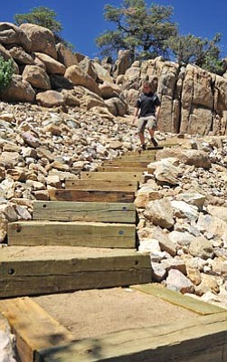 Matt Hinshaw/The Daily Courier<br>Prescott Trails Specialist Chris Hosking walks along a section of the Centennial Trail, which was completed after the city’s 2011 purchase of more than 30 acres of open space.