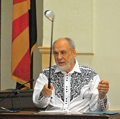 Matt Hinshaw/The Daily Courier<br>Dr. Philip Keene, former Yavapai County Medical Examiner, talks about the use of a golf club as a weapon while being cross-examined by the defense Thursday morning at the Yavapai County Courthouse.