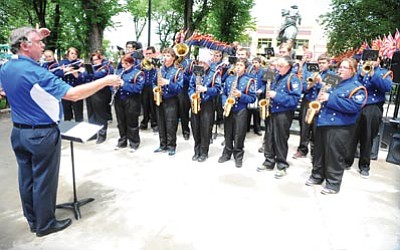 Les Stukenberg/The Daily Courier<br>The Chino Valley High School marching band performs Saturday between rainstorms as part of the Acker on the Plaza event at the Yavapai County Courthouse Plaza.
