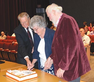 Heidi Dahms Foster, Prescott Valley Tribune/Courtesy photo<br>Prescott Valley Mayor Harvey Skoog, who served from 1993-1998 and 2004 to the present; former Mayor Carm Staker, who served from 1983 to 1985; and former Mayor Phil Beeson, who served from 1985 to 1987, cut a cake during a celebration for Prescott Valley’s 35th anniversary during the town council meeting Thursday evening. 
