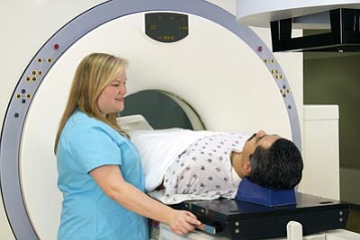 Photos.com<br>A man gets a CAT scan for prostate cancer. Take preventive measures by getting a digital rectal exam or a prostate-specific antigen test. Symptoms of prostate cancer include trouble emptying one’s bladder completely; pain with urination; blood in urine; or difficulty starting to urinate. Pain during ejaculation, blood in semen and chronic pain in the hips and back are other symptoms.