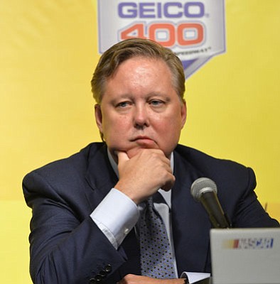 Nam Y. Huh/The Associated press<br>NASCAR Chairman and CEO Brian France listens to questions during a news conference at Chicagoland Speedway in Joliet, Ill., on Sept. 13, 2013. NASCAR added Jeff Gordon to the Chase for the Sprint Cup championship field Friday, a stunning and unprecedented step in the fallout from at least two attempts to manipulate the results at the season-ending race at Richmond last weekend.