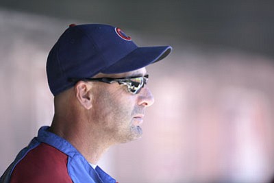 Jeff Roberson/The Associated Press<br>
Former Cubs manager Dale Sveum watches from the dugout during his final weekend as Chicago’s skipper. The Cubs set a franchise record in home losses in 2013 and a franchise record in road losses in 2012.