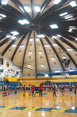 Patrick Whitehurst/The Daily Courier<br>The dome roof, ceiling tiles and outside wall of the Prescott High School gym, pictured during a recent volleyball game, were replaced and repaired with money from an $18.7 million bond approved by voters in 2004.