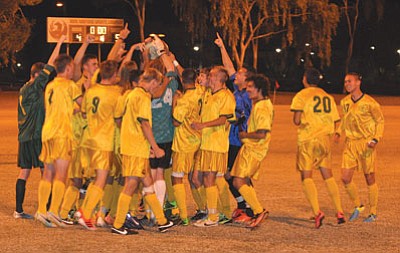 Courtesy photo<br>It's a familiar sight when a Yavapai soccer team hoists a Region 1 Championship trophy. They have 21 of them since 1990. But how they clinched Saturday night's was historic.