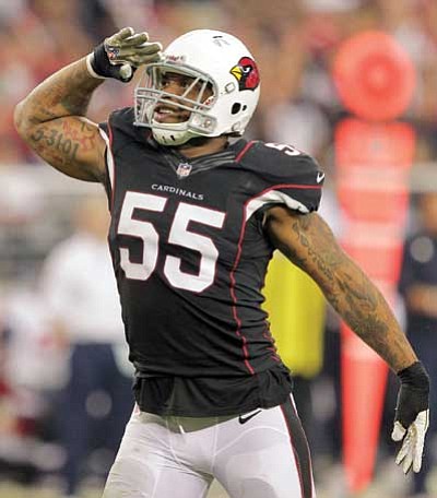 Rick Scuteri/The Associated Press<br>
Arizona Cardinals outside linebacker John Abraham salutes the crowd after sacking Houston Texans quarterback Case Keenum during their  game Sunday in Glendale.