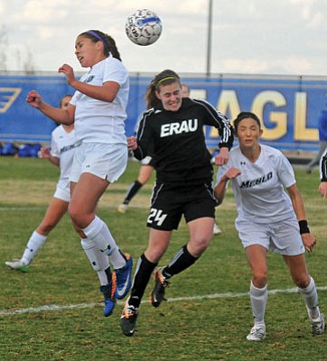 Matt Hinshaw/The Daily Courier<br>Embry-Riddle’s Kalynn Huebner (24) tries to head the ball against Menlo College’s Kayla Cisneroz while falling into Menlo’s Megan Mckee Friday afternoon in Prescott.