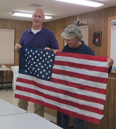 Jeep Posse member honors volunteers with flag he carried in