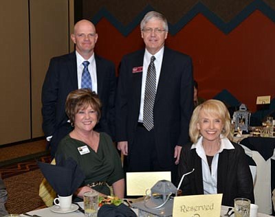Courtesy photo<br>Prescott Chamber of Commerce Chairman Matt Holdsworth and Chief Executive Officer Dave Maurer, along with Marnie Uhl, president and CEO of the Prescott Valley Chamber of Commerce, pose with Gov. Jan Brewer at a recent event.