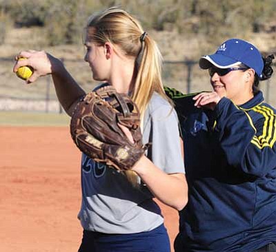 Les Stukenberg/The Daily Courier<br>
Embry-Riddle head softball coach Marie Thomason works with California high school recruit Kaila Provost during a practice Jan. 22 in Prescott.