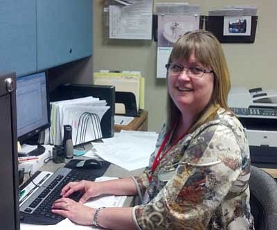 Courtesy photo<br>
Ronda Guedel, eligibility specialist for West Yavapai Guidance Clinic, works with clients to help them navigate the AHCCCS application process.