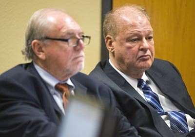 Tom Tingle/The Associated Press<br>Attorney Michael Kimerer, left, works on behalf of Arizona Attorney General Tom Horne, right, during a hearing Feb. 10 in Phoenix.