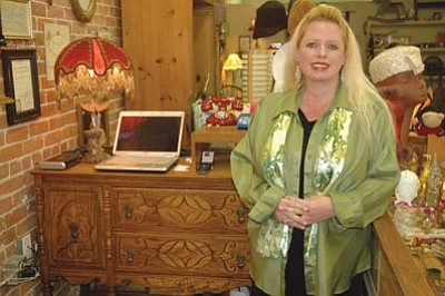 Patrick Whitehurst/The Daily Courier<br>
So Forth & What Not by Tatianna owner Tonya Howard stands inside her new business on Cortez Street near downtown Prescott. She opened the business, which features “a little bit of everything” in late November. Merchandise at the store includes antiques, collectibles, clothing for men and women, and more.
