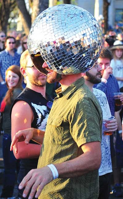 Courier file<br>
A reveler enjoys the Roger Clyne & The Peacemakers show during the 2013 Whiskey Off-road in downtown Prescott.