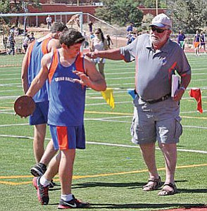 Courtesy photo<br>In this undated photo, Chino Valley’s longtime track and field throwing coach and football coach Richard Feichter works with a Cougar student-athlete.
