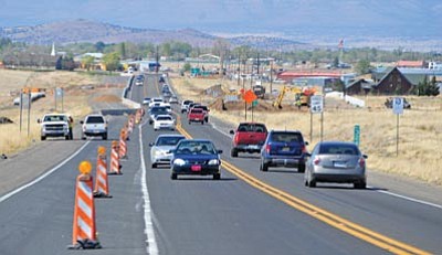 Matt Hinshaw/The Daily Courier<br>Traffic builds up coming out of and going into Chino Valley on Highway 89 just south of the Outer Loop Road and Road 4 South traffic circle Thursday afternoon. The widening of Highway 89 between Chino Valley and Prescott started this past March and is scheduled to be completed in the summer of 2015.