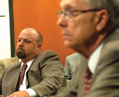Scott Orr/The Daily Courier<br>
John Napper, left, listens as outgoing Public Defender Dean Trebesch talks to the county Board of Supervisors about fiscal year 2014-15 budget issues on Wednesday.
