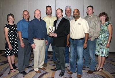 Courtesy photo<br>
From left, Jennifer Toth (ADOT), Paul Baca (URS), Steve Pageau (URS), Abe Geupel (Fann Contracting), Alvin Stump (ADOT), Marty Schulte (ADOT), Bobby Lall (ADOT/Horrocks Engineers), T.C. Fish (ADOT), and Amanda McGennis (AGC) pose for the award Fann Contracting Inc. and ADOT received for the Sunset Point Rest Area Rehabilitation project.

