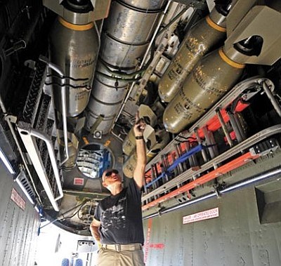 Matt Hinshaw/The Daily Courier<br>Stuart Watkins, a crew member on the Commemorative Air Force’s Boeing B-29 Superfortress Fifi, talks about the plane’s bomb bay and how it would have been used in World War II Thursday morning at the Prescott Airport.