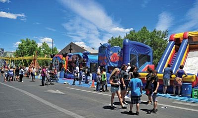 Matt Hinshaw/The Daily Courier<br>
People fill the Family Fun Zone on Cortez Street during the Prescott Sesquicentennial Celebration Saturday.