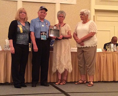 Courtesy photo<br>
Trudy Chapman-Radley, second from right, received the Charles Shinholser Award for her contribution to C.O.P.S. (Concerns of Police Survivors) during National Police Week in Washington, D.C. in May. Standing with her are, from left, C.O.P.S. national president, Madeline Neumann, Shinholser, for whom the award is named, and Suzie Sawyer, who co-founded C.O.P.S. with Chapman-Radley.
