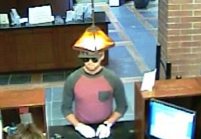 Prescott Police Department courtesy photos<br>
A suspect in the Monday morning bank robbery in Prescott approaches the teller windows.