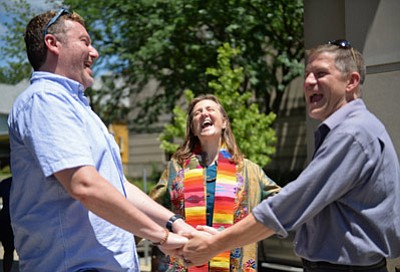 Bloomington Herald-Times, Chris Howell/The Associated Press<br>Rev. Mary Ann Macklin officiates the wedding ceremony of Jeff Jewel, left, and Jeff Polling, who have been together for 18 years, on the steps of the Monroe County Justice Building in Bloomington, Ind., Wednesday. <br /><br /><!-- 1upcrlf2 --><br /><br /><!-- 1upcrlf2 -->