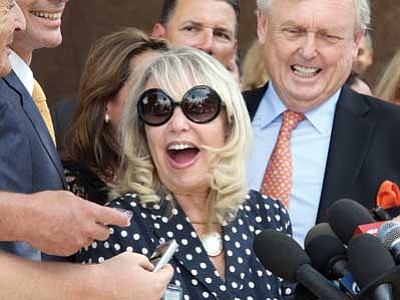 Nick Ut/The Associated Press<br>
With her attorney Pierce O’Donnell, right, Shelly Sterling talks to reporters after a judge ruled in her favor and against her estranged husband, Los Angeles Clippers owner Donald Sterling, on Monday.