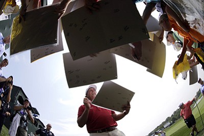 David J. Phillip/The Associated Press<br>Phil Mickelson signs autographs after a practice round for the PGA Championship at Valhalla on Tuesday in Louisville.