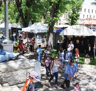 Crowds buzz around downtown Prescott’s courthouse square Saturday for the Phippen Museum’s annual Western Art Show, Sale & Auction. (Patrick Whitehurst/The Daily Courier)