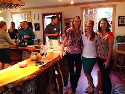 Erin Vredeveld with Canyon Physical Therapy and Aquatic Rehabilitation, Ariana Bennett with Cable One and Bree Hinkel with BJH Designs were among the Prescott Area Young Professionals who attended the PAYP wine-tasting at Granite Creek Vineyards on Aug. 14. (Courtesy photo)