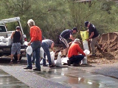 County officials and volunteers help Black Canyon City residents fill sandbags Tuesday. (Courtesy photo/YCSO) <br /><br /><!-- 1upcrlf2 -->