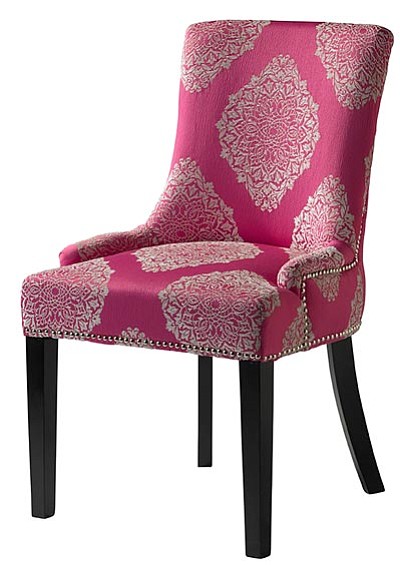 This photo provided by HomeGoods.com shows an armless accent chair with a lace and filigree pattern in a soft pink hue. Lace and filigree motifs are a popular trend this fall. (The Associated Press/HomeGoods.com)