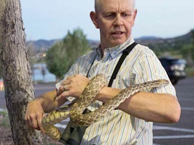 Eric Moore encounters a snake during a recent outing in Prescott. (Courtesy photo)