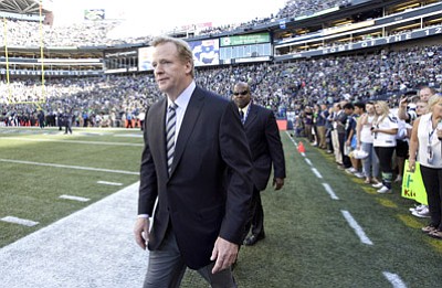 Elaine Thompson/The Associated Press<br>NFL Commissioner Roger Goodell walks on the field before last Thursday’s game between the Seahawks and Packers in Seattle.