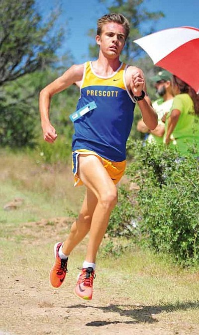 Matt Hinshaw/The Daily Courier<br>Prescott’s Simon Paige leads the pack down a hill during the 42nd Annual Ray Wherley Invitational at Embry-Riddle Saturday afternoon in Prescott. Paige finished second with a time of 15:06.77.