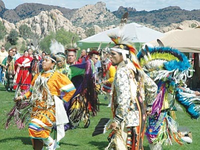 Head Woman Orena Flores and Head Man Paul Flores IV lead dancers during the Prescott Intertribal Pow-wow on Saturday at Watson Lake Park. (Mark Duncan/The Daily Courier)